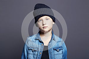 Portrait of child. handsome little boy in jeans and hat