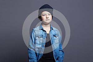 Portrait of child. handsome little boy in jeans and hat