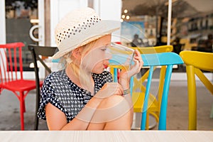 Portrait of a child that is having a good time on a cafe terrace