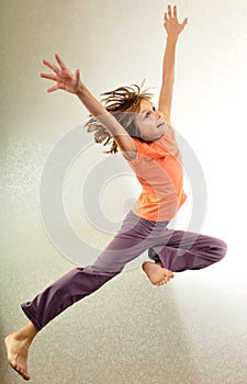 Portrait of child jumping and dancing