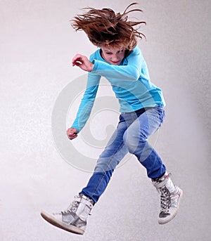 Portrait of child jumping and dancing