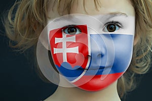 Portrait of a child with a painted Slovakian flag
