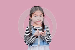 Portrait child school girl on pink background