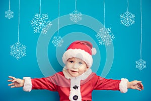 Portrait of child wearing Santa Claus costume