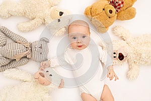 Portrait of a child on a white background with headphones. stay home, coronavirus 19. Baby 6 months listening to music. Space for