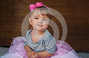 Portrait of a child on a wooden background