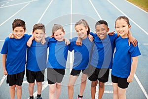 Portrait Of Children In Athletics Team On Track On Sports Day