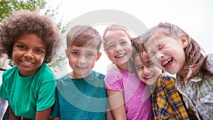 Portrait Of Children On Outdoor Activity Camping Trip Having Fun Playing Game Together