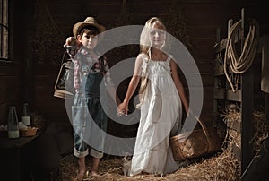 Portrait of children in a rustic barn