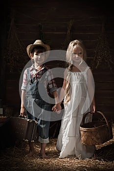 Portrait of children in a rustic barn