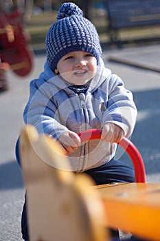 Portrait of children swinging on the swings balancers