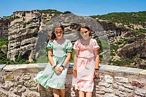Portrait of children visiting the famous Meteora monastery in Greece