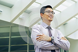 Portrait Chinese Businessman Contemplating Office Skyscraper