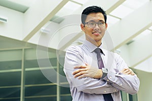 Portrait Chinese Businessman Smiling Outside Office Text Space photo