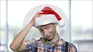 Portrait of Christmas boy on blurred background.