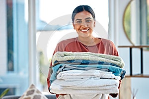 Portrait, cleaning or woman with laundry or happy smile after washing clothes or towels in cleaning services