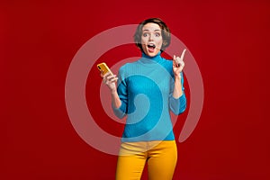 Portrait of clever funky girl blogger social media user use smartphone text message have wonderful idea type scream wow