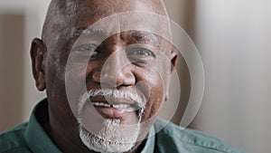 Portrait close clever serious pensive male wrinkled face with gray beard bald African old senior mature thoughtful