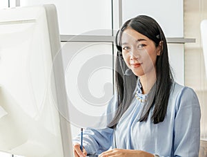 Portrait close up Asian woman Smiling female call center operator