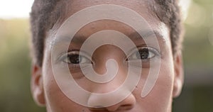 Portrait close up happy african american woman smilling in garden, in slow montion