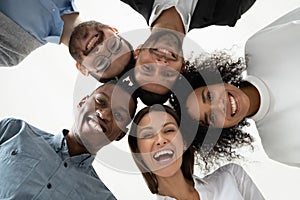 Portrait close up happy diverse employees team standing in circle