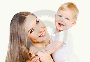 Portrait close-up happy smiling mother and baby having fun together isolated on white