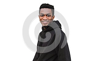 Portrait close up happy young smiling african man looking at camera wearing a black hoodie isolated on a white background