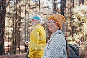 Portrait close up head shot of one cheerful smiling middle age woman walking with her husband enjoying free time and nature.