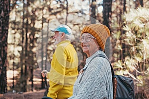 Portrait close up head shot of one cheerful smiling middle age woman walking with her husband enjoying free time and nature.