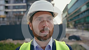 Portrait close up man worker repairman in safety helmet looking around smile male contractor wearing hardhat architect