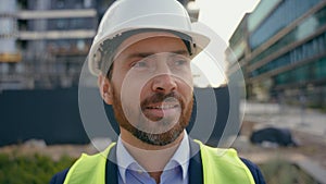 Portrait close up man worker repairman in safety helmet looking around smile male contractor wearing hardhat architect