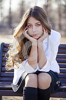 Portrait close up of young beautiful blonde schoolgirl