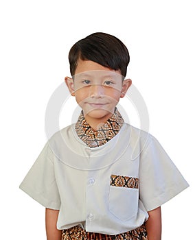 Portrait closeup of Asian boy child wearing traditional Thai dress look at camera over white background