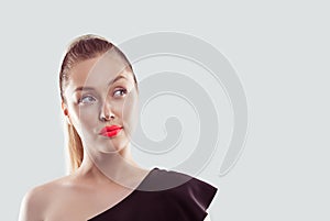 Portrait closeup funny confused skeptical woman girl female thinking looking up to the side isolated light blue wall background