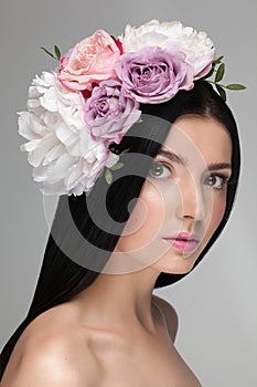 Portrait closeup of a young beautiful model girl with perfect shiny skin.