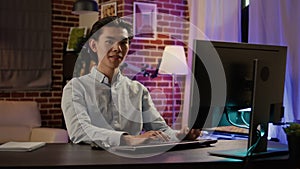 Portrait of company worker using computer to write email