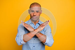 Portrait of concentrated man warn dislike disagree idea have conflict denim jeans isolated over yellow background