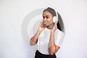 Portrait of concentrated young woman listening to music