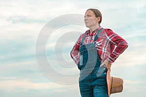 Portrait of concerned female farmer agronomist outdoors