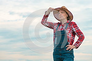 Portrait of concerned female farmer agronomist outdoors