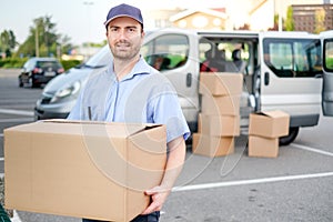 Portrait of confidence express courier and delivery van