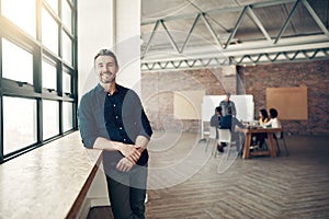 Portrait, confidence and man in modern office, ceo at creative startup and business for entrepreneur at design agency