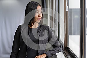 Portrait of Confident Asian business woman standing in the office