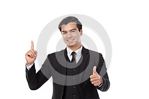 Portrait of a confident business man in black suit smile and pointing to copy space isolated on white background. Portrait