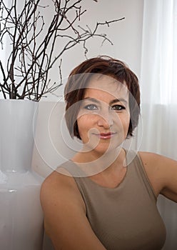 Portrait of a confident business woman about 35-40 years old looking at the camera