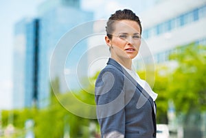 Portrait of confident business woman in modern office district