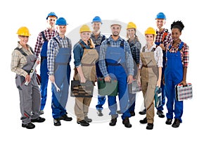 Portrait Of Confident Carpenters Carrying Toolboxes