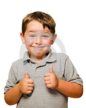 Portrait of confident child showing thumbs up