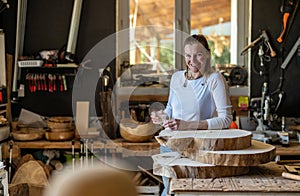 Portrait of confident craftswoman in her workshop