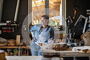 Portrait of confident craftswoman in her workshop